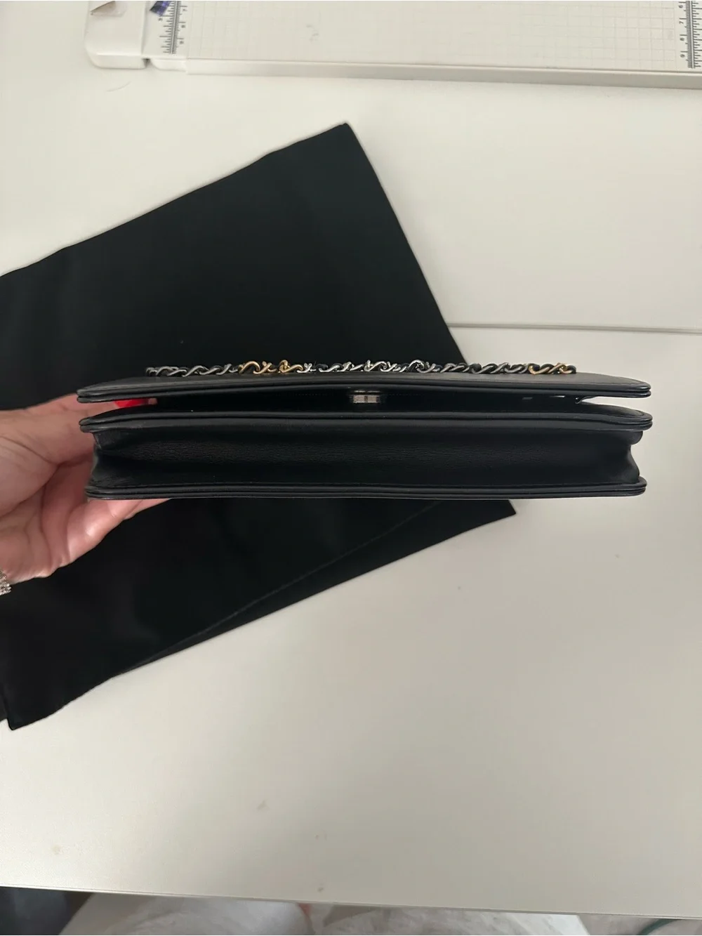 CHANEL Black Leather Clutch with Mixed Metal Chain Script